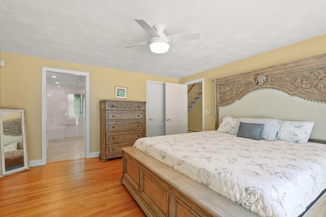 34 Marla Ln, Hatchville, MA 02536 - bedroom with light wood-style flooring, baseboards, ensuite bath, a closet, and ceiling fan