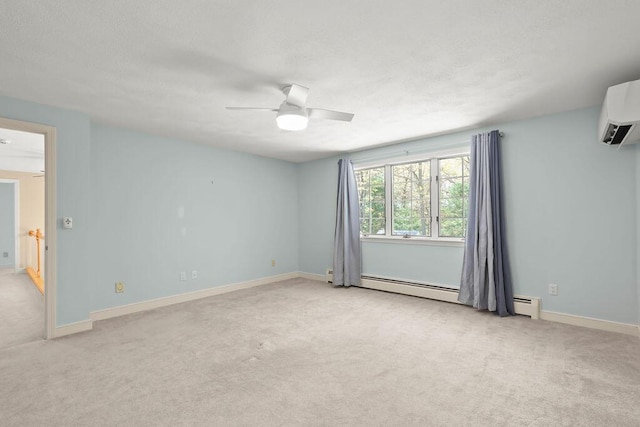 34 Marla Ln, Hatchville, MA 02536 - spare room featuring a wall mounted air conditioner, light carpet, a ceiling fan, baseboards, and a baseboard heating unit