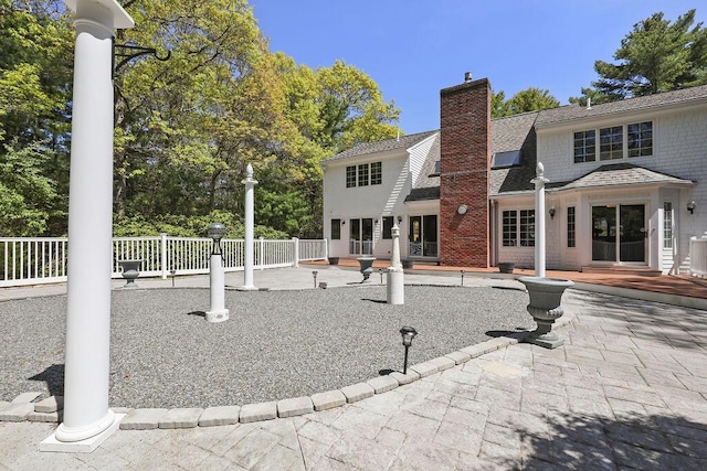 34 Marla Ln, Hatchville, MA 02536 - rear view of property with fence, a patio area, and a chimney