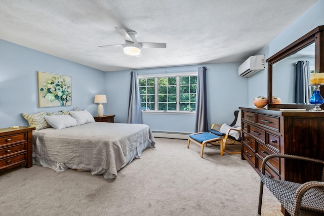 34 Marla Ln, Hatchville, MA 02536 - bedroom featuring a wall mounted AC, a baseboard heating unit, light carpet, a textured ceiling, and a ceiling fan
