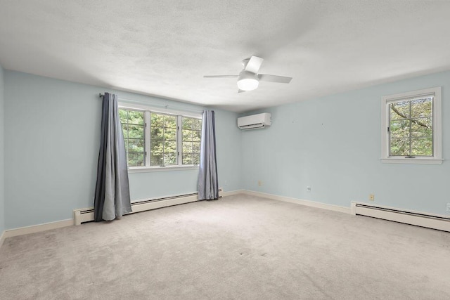 34 Marla Ln, Hatchville, MA 02536 - empty room with a wall unit AC, plenty of natural light, carpet floors, and a textured ceiling