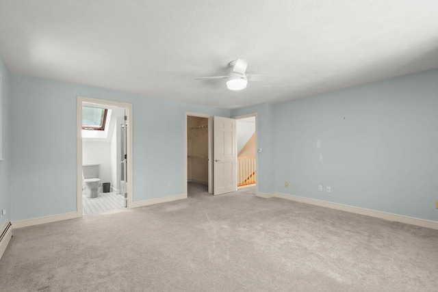 34 Marla Ln, Hatchville, MA 02536 - unfurnished bedroom featuring a spacious closet, light carpet, a closet, baseboards, and ensuite bath