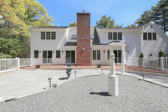 34 Marla Ln, Hatchville, MA 02536 - back of house featuring a patio area, a chimney, a wooden deck, and a shingled roof