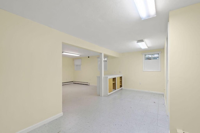 34 Marla Ln, Hatchville, MA 02536 - basement with baseboards, a baseboard heating unit, and light flooring