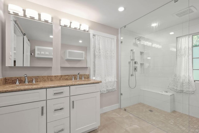 34 Marla Ln, Hatchville, MA 02536 - bathroom with tiled shower, double vanity, tile patterned flooring, and recessed lighting