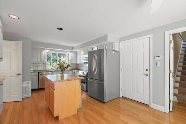 34 Marla Ln, Hatchville, MA 02536 - kitchen featuring stainless steel appliances, backsplash, light wood finished floors, light countertops, and recessed lighting