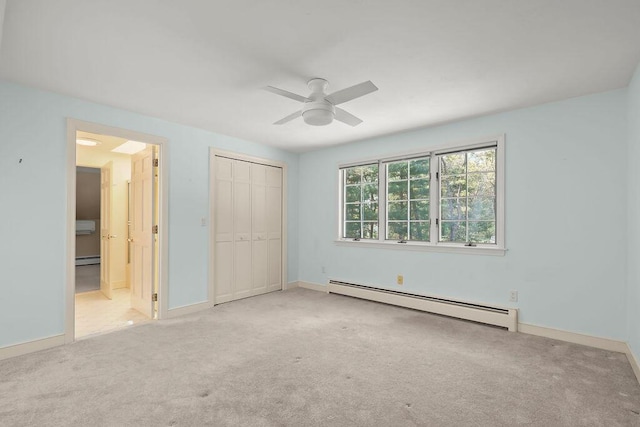 34 Marla Ln, Hatchville, MA 02536 - unfurnished bedroom with baseboard heating, carpet flooring, a closet, and baseboards