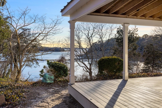 wooden deck with a water view