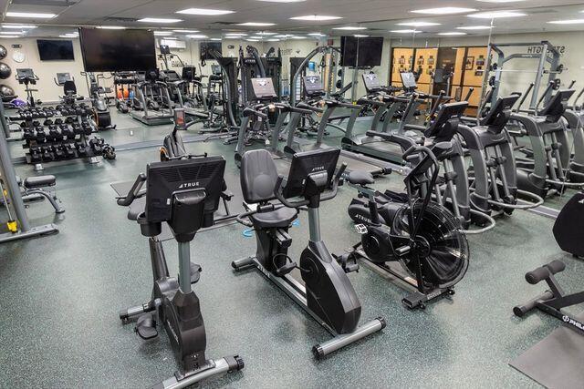 workout area with a paneled ceiling