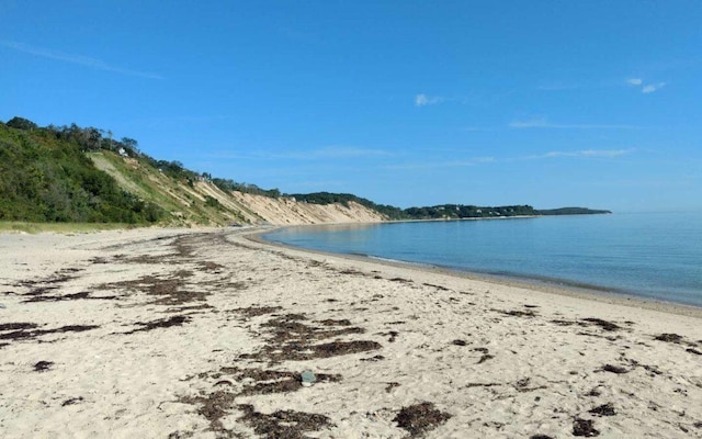 property view of water featuring a beach view