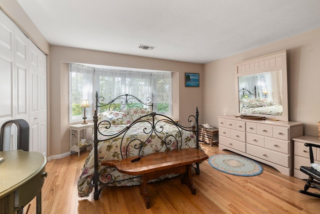 bedroom featuring light hardwood / wood-style flooring and a closet