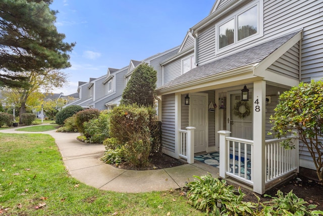 property entrance with a yard