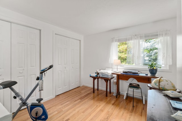 office with light wood-type flooring