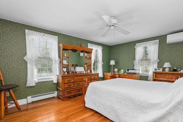 105 Rolling Hitch Rd, Centerville, MA 02632 - bedroom with wallpapered walls, a wall mounted air conditioner, light wood-style flooring, baseboard heating, and multiple windows