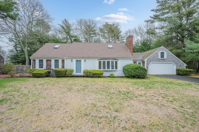 105 Rolling Hitch Rd, Centerville, MA 02632 - single story home featuring a chimney, fence, a front lawn, driveway, and a garage