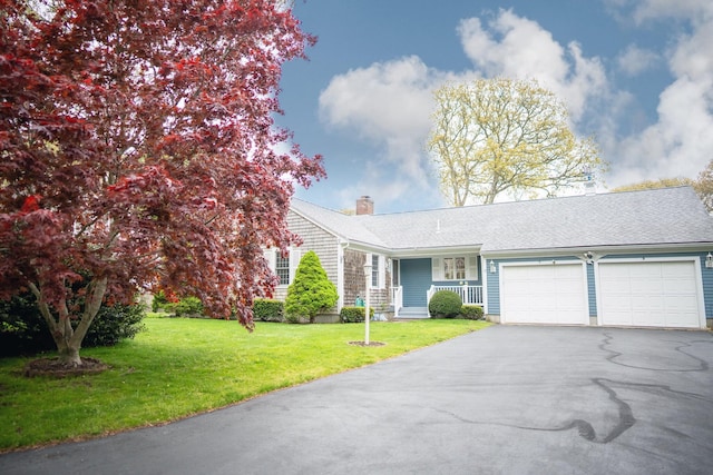 12 Longview Dr, Yarmouth Port, MA 02675 - ranch-style home with a garage, a chimney, driveway, a front lawn, and covered porch