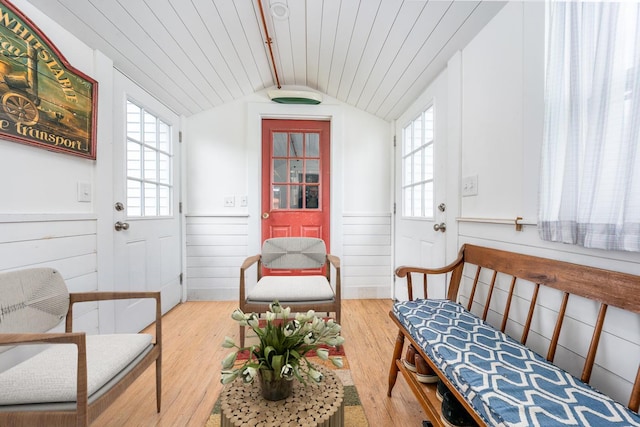 sunroom / solarium featuring french doors and beam ceiling