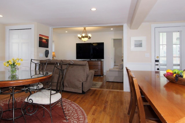 living room featuring a chandelier, wood finished floors, and recessed lighting