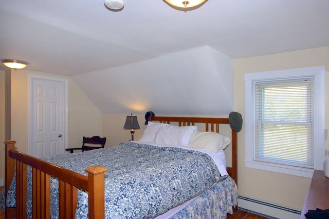 bedroom featuring lofted ceiling, baseboards, dark wood-type flooring, and a baseboard radiator