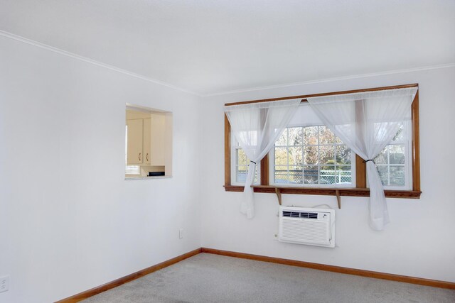 carpeted empty room with crown molding and a wall mounted air conditioner