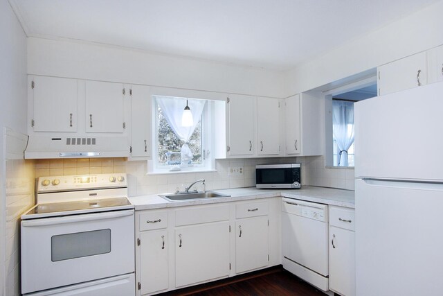 kitchen featuring sink, white appliances, decorative backsplash, and white cabinets