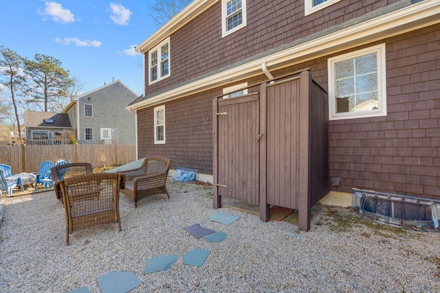 view of patio featuring fence and an outdoor hangout area