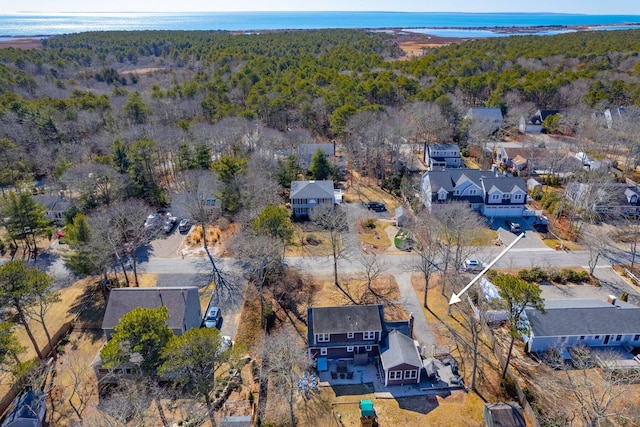 bird's eye view featuring a water view, a residential view, and a view of trees