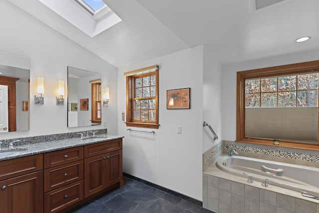 full bath featuring a wealth of natural light, visible vents, lofted ceiling with skylight, and a sink