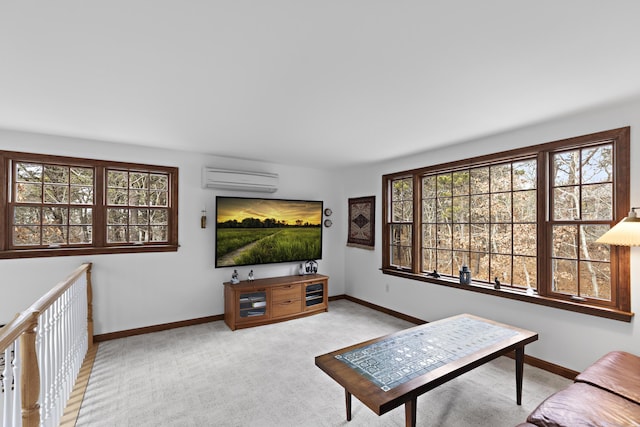 living room featuring a wealth of natural light, baseboards, and a wall unit AC