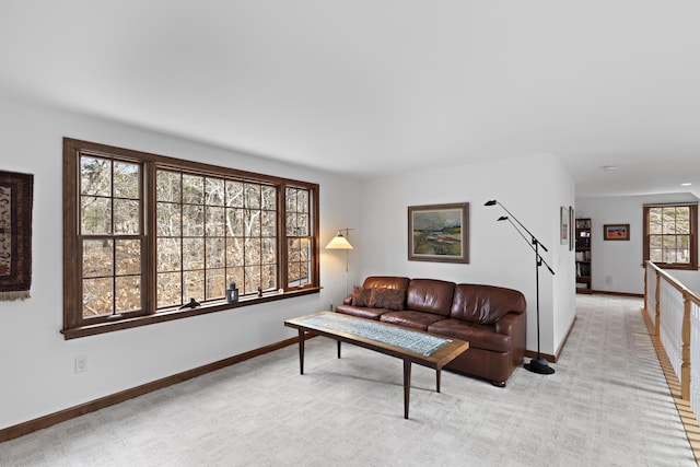 living room with light colored carpet and baseboards