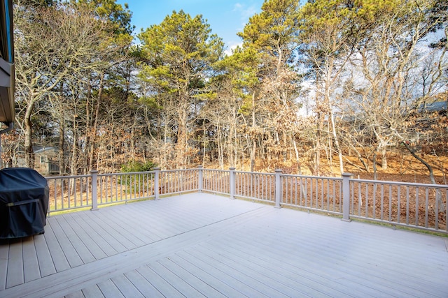 wooden terrace featuring grilling area