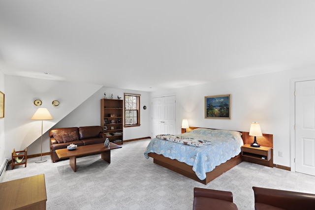 carpeted bedroom with baseboards and a closet