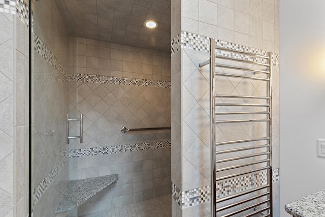 full bath featuring a shower stall, radiator, and recessed lighting