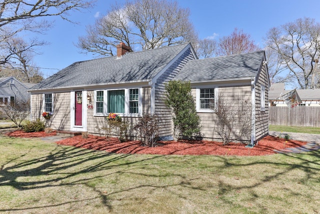 16 Samoset Rd, South Yarmouth, MA 02664 - view of front of property with fence, a front yard, a chimney, and a shingled roof