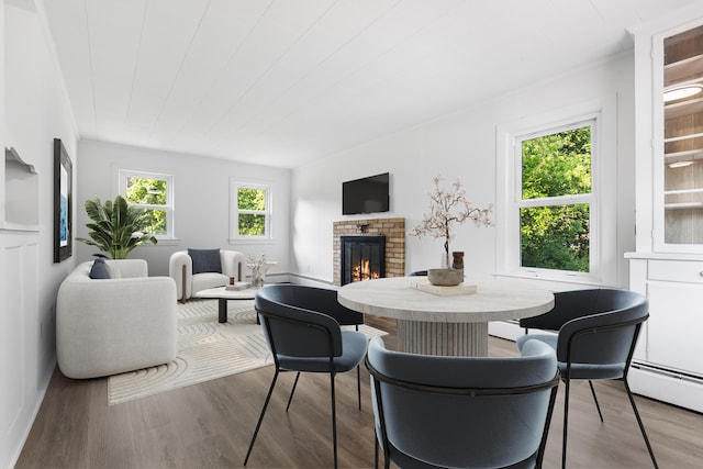 30 Terry Ct, Hyannis, MA 02601 - dining area featuring a brick fireplace and wood finished floors