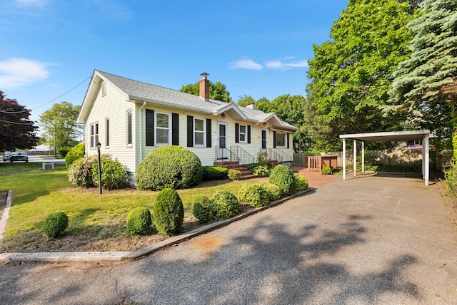 30 Terry Ct, Hyannis, MA 02601 - ranch-style house with a chimney, driveway, and a front lawn