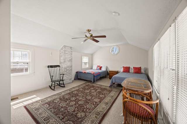 carpeted bedroom featuring visible vents, ceiling fan, lofted ceiling, and multiple windows