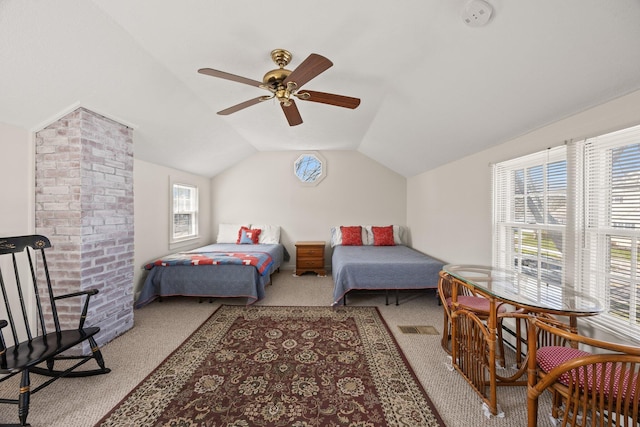 bedroom with visible vents, carpet flooring, ceiling fan, and vaulted ceiling