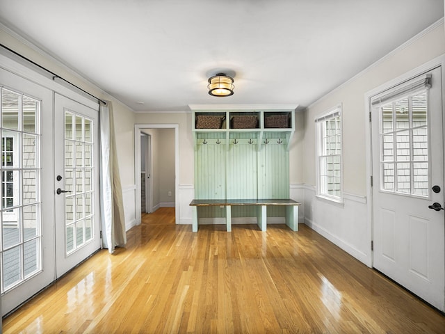 9 Cogswell Path, West Yarmouth, MA 02673 - mudroom featuring crown molding, light wood finished floors, and french doors