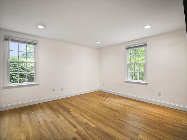 9 Cogswell Path, West Yarmouth, MA 02673 - unfurnished room featuring plenty of natural light, wood finished floors, baseboards, and recessed lighting