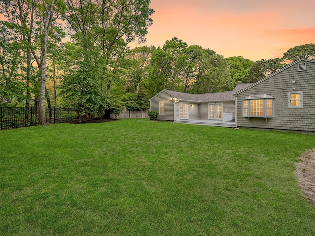 9 Cogswell Path, West Yarmouth, MA 02673 - yard at dusk with french doors