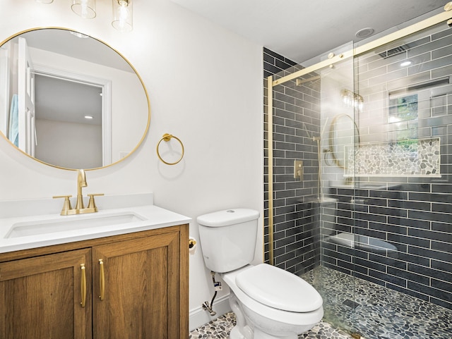 9 Cogswell Path, West Yarmouth, MA 02673 - bathroom featuring toilet, vanity, a stall shower, and baseboards