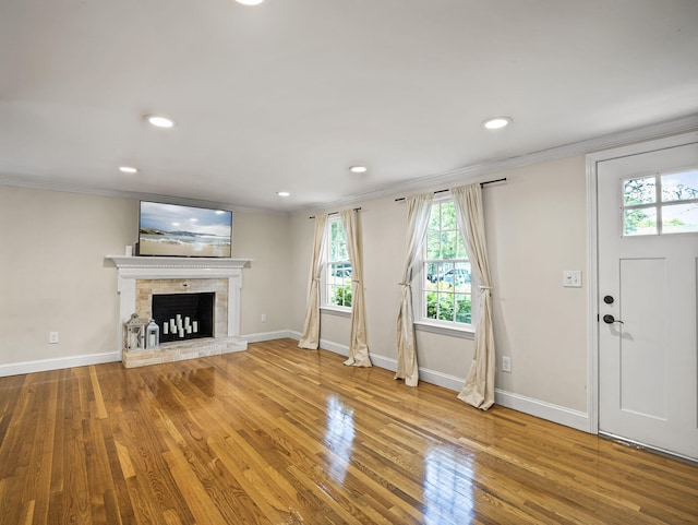 9 Cogswell Path, West Yarmouth, MA 02673 - unfurnished living room featuring ornamental molding, wood finished floors, a fireplace, recessed lighting, and baseboards