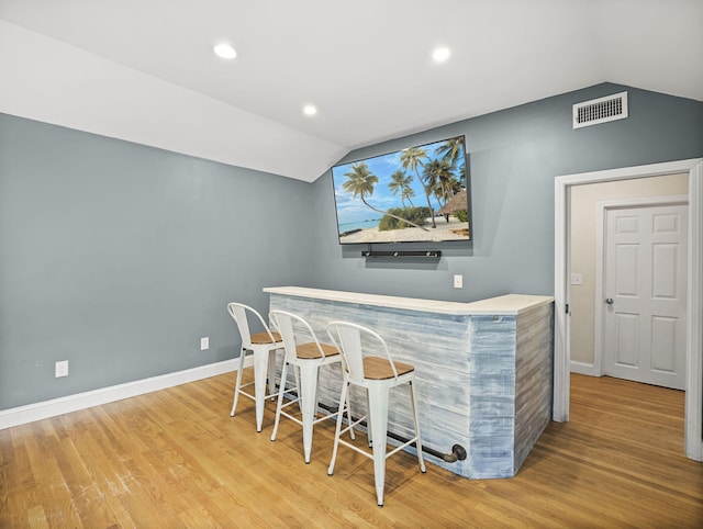 9 Cogswell Path, West Yarmouth, MA 02673 - indoor dry bar with vaulted ceiling, light wood finished floors, baseboards, and recessed lighting