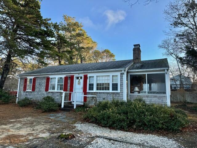 view of front of house with a sunroom