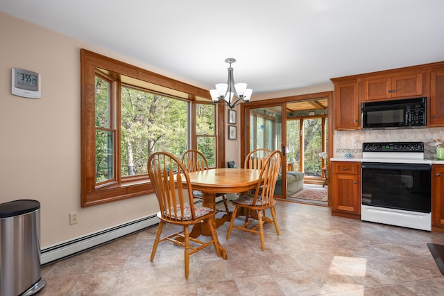 dining area with a baseboard heating unit, a chandelier, and plenty of natural light