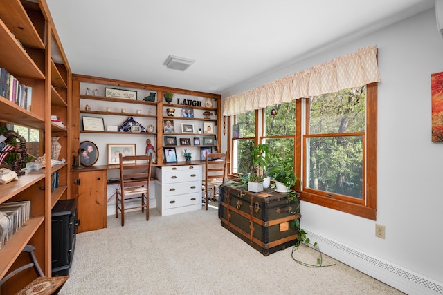 carpeted home office featuring baseboard heating and healthy amount of natural light