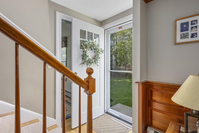 entrance foyer featuring stairs and wood finished floors