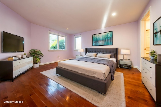 bedroom featuring recessed lighting, baseboards, and wood finished floors