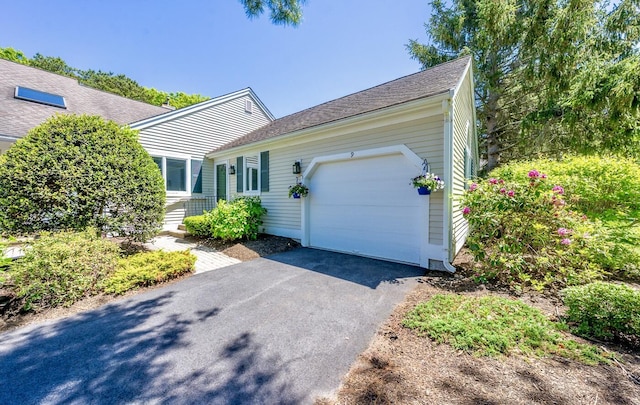 9 Longwood Rd, Mashpee, MA 02649 - single story home featuring an attached garage and asphalt driveway